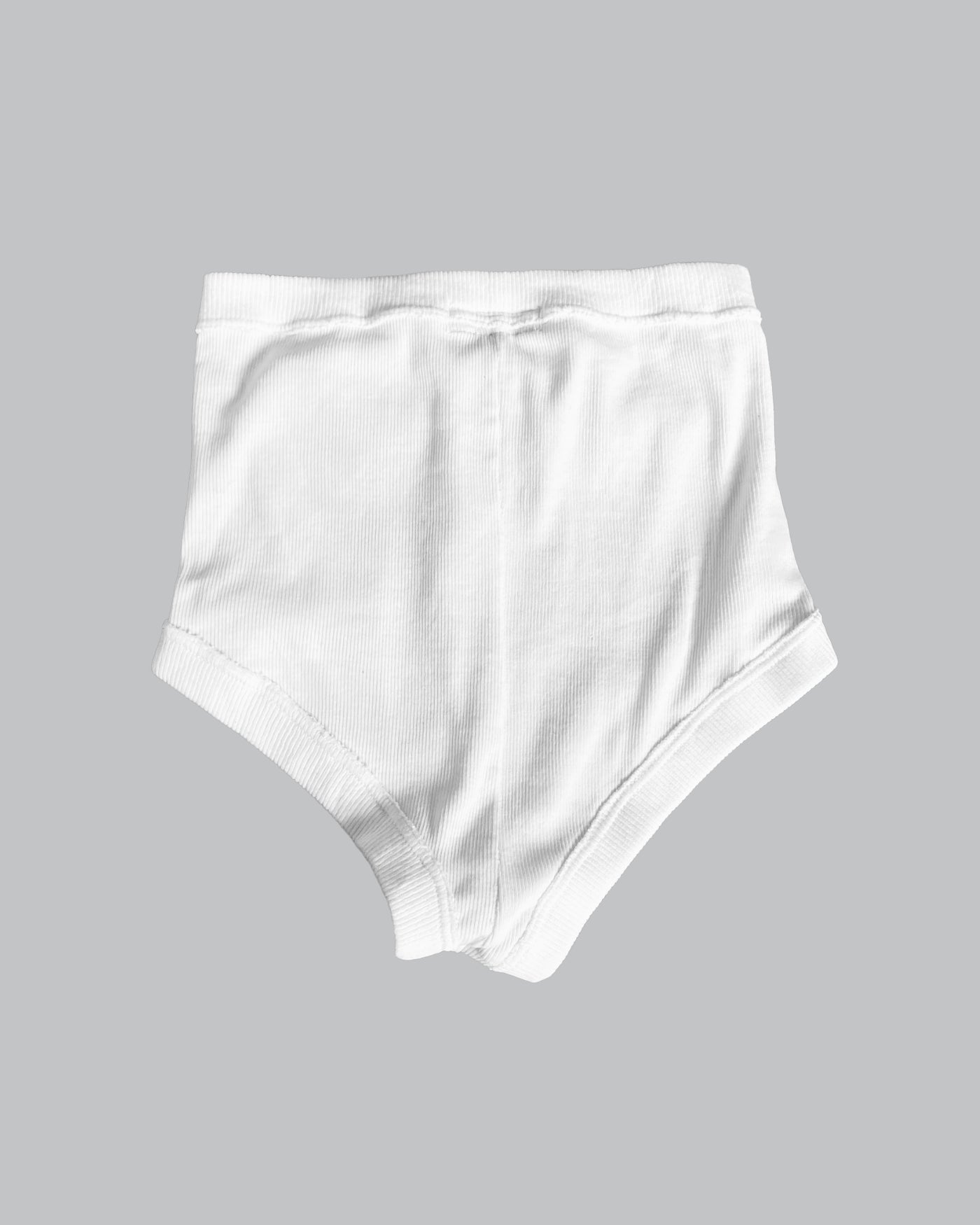 White high-waisted shorts on a gray background